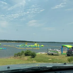 Wibit on the lake. Can wear water shoes. Picnic tables and small grills available. Bring a blanket and have a picnic!