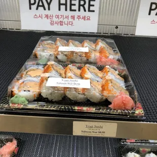 a display of various types of sushi
