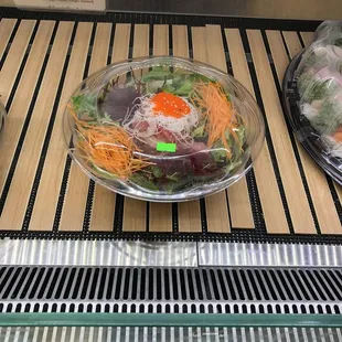 a salad in a glass bowl