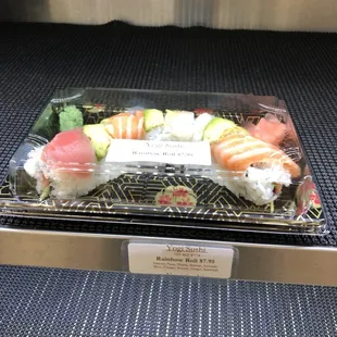 a tray of sushi on a conveyor belt
