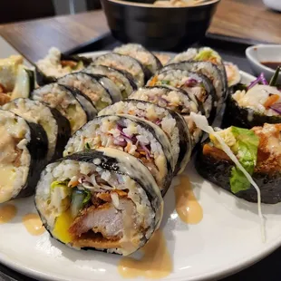 a plate of sushi rolls on a table