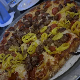 Sausage pepperoni and banana pepper pizza