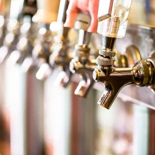 a row of beer taps