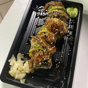 a plate of sushi and broccoli