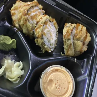 a bento tray with a variety of food items