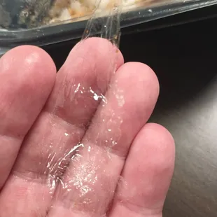 a person holding a piece of food in their hand