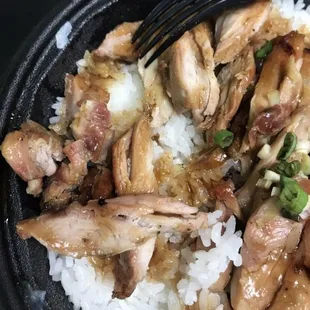 a plate of chicken and rice