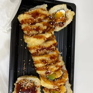 a close up view of a tray of sushi