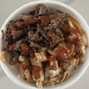 Teriyaki chicken and beef bowl with sriracha sauce...