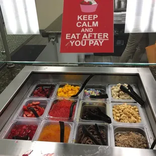 a keep calm and eat after you pay sign