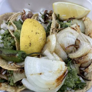 A plate of six tacos