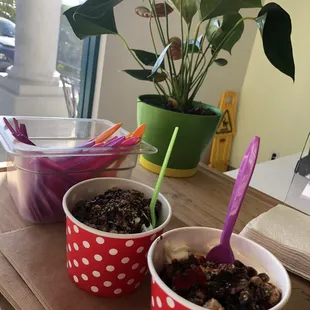 two cups of yogurt on a table