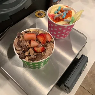 two bowls of yogurt and a bowl of fruit