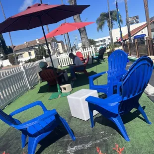 blue chairs and umbrellas