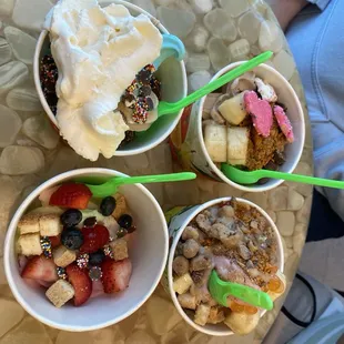 three bowls of yogurt and fruit