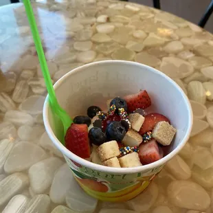 a yogurt bowl filled with fruit