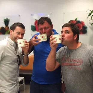 three men drinking coffee