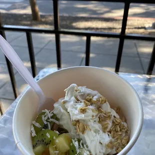 Nonfat yogurt, pineapples, kiwi, coconut ....3rd time this week! Can&apos;t get enough of this combo (pina colada)
