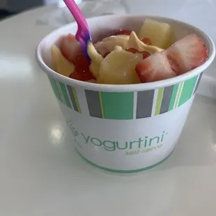 Pineapple and banana frozen yogurt with pineapple, strawberries and kiwi.