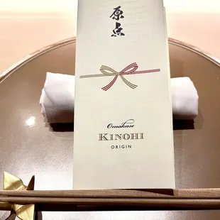 The evening&apos;s omakase courses are presented on this take-away menu.