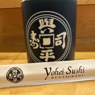 a roll of paper and a cup of coffee