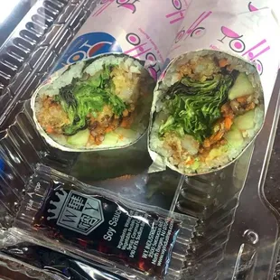 two burritos in a plastic container