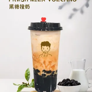 a cup of blackberries and a pitcher of milk