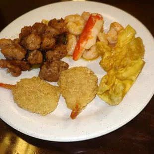 Pepper Chicken, Seafood Medley, Crab Rangoon, And Breaded Shrimp.