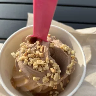 Chocolate shake yogurt with nuts and caramel sauce