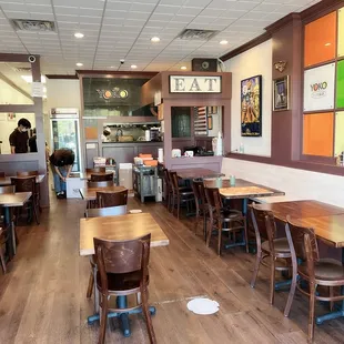 the inside of a restaurant with tables and chairs