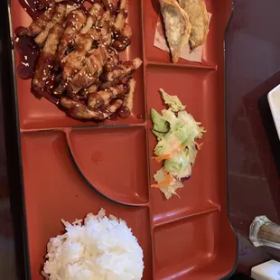 Smallest Sesame Chicken Bento I have ever seen. The chicken tasted old and gyoza tasted like dirty laundry.