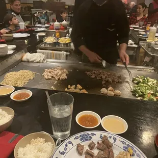 Steak, chicken, shrimp, scallops, veggies, noodles.