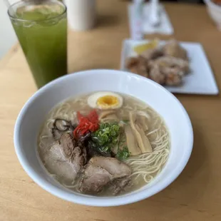 a bowl of ramen and a drink