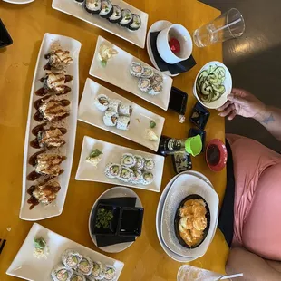 a variety of sushi dishes on a table