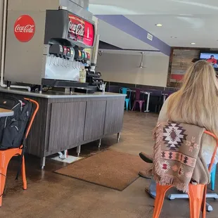 a woman sitting at a counter