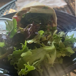 a plate of salad and pita bread