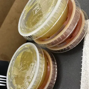 a close up of a stack of food in plastic containers