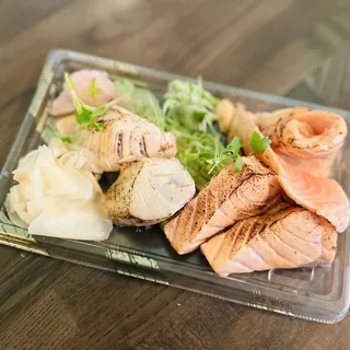 2 pcs Seared Hamachi Japan and 2 pcs Seared Salmon with Torch