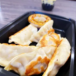 a close up of a plate of dumplings