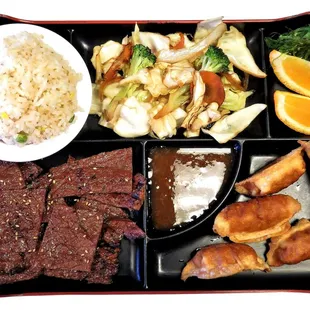 KOREAN BBQ BOX      Bulgogi - $ 9.99 , Kalbi - $ 10.99    ( Rice , Vegetables , Seaweed Salad , Orange , Yaki Mandu )