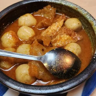 Spicy sauce but really good, fish balls with pork skin and tofu