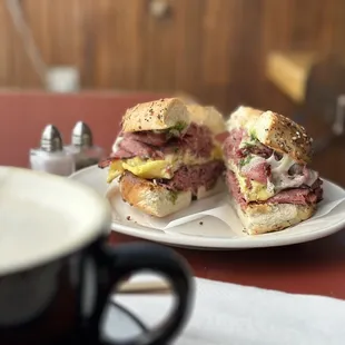Our creation: The Brunch Boiiiiiii Everything Bagel, Egg, Swiss, Pastrami, garlic sauce  London Fog in the foreground.