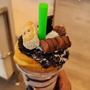 a hand holding a cup