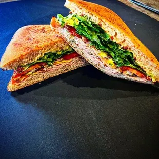 Turkey Focaccia Club- House-smoked pesto crusted turkey breast, lettuce, tomato, red onion, bacon, provolone cheese &amp; lemon basil aioli.
