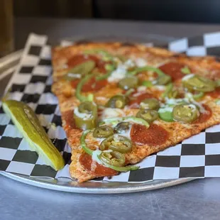 *G SLICE- PEPPERONI with green peppers, jalapeños and a Dallas Blonde.