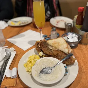 Eggs, fish, grits and Manmosa