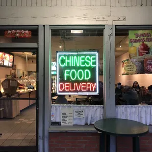 a neon sign in the window