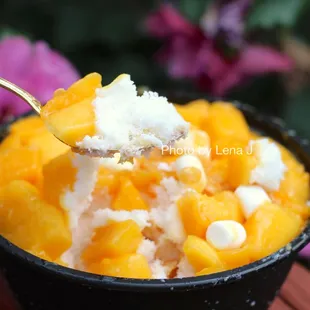 Mango Snow Flake ($14.50) - takeout bingsu. Big portion; the mango is great and very ripe. Has cornflakes on the top.