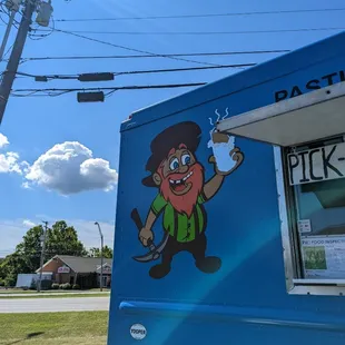 a man holding a glass of beer