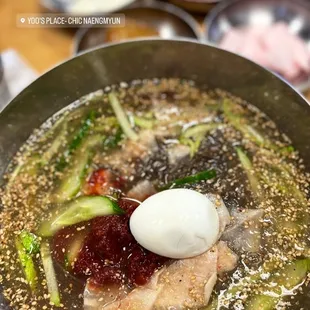 a bowl of ramen with an egg on top